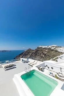 Images Dated 8th May 2019: Scenic view of traditional cycladic resort with Jacuzzi in foreground, Oia village, Santorini