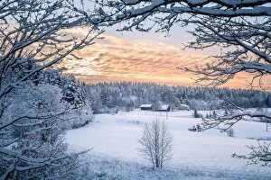 Images Dated 24th December 2018: Scenic winter landscapw with farm house and sunset at evening light in Finland