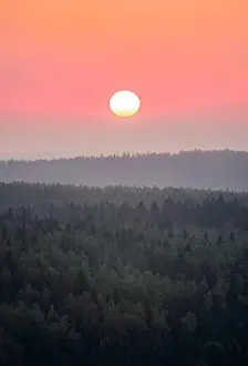 Afterglow Prints: Scenic woodland landscape with rising sun at autumn morning in Finland