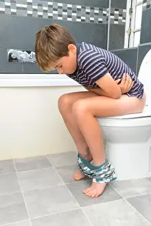 11 Year Old Prints: School boy on toilet in great pain