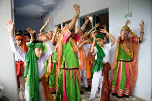 Wearing Prints: School boys girls wearing green color traditional dress performing group dance Independence day celebration Dilwara