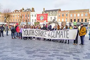 Passionate Prints: School children at a small youth strike for climate change demonstration holding their banner and placards