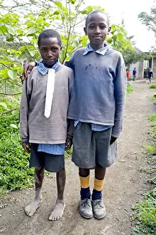 Posed Prints: Two schoolboys in make-do school uniform
