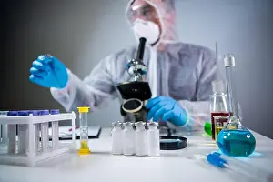 Chemist Prints: Scientist or medic in protective overalls