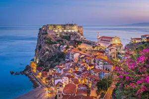 Scilla, Italy on the Mediterranean coast at twilight with seasonal flowers