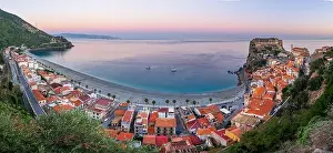 Scilla, Italy on the Mediterranean coast at twilight with seasonal flowers