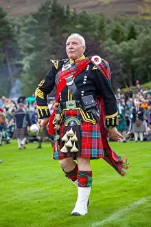 Tartan Prints: Scottish pipe band Drum Major in Highland Dress at Braemar Highland Games, Scotland, UK