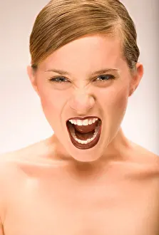 Screaming Prints: screaming 20-30 year old woman on a plain background