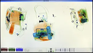 Screening Prints: screenshot from an airport x-ray luggage security scanner