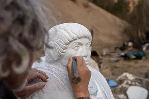Imitation Prints: Sculptor working on his statue using a chisel to work on details