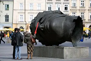Market Square Prints: Sculpture of a head in The Main Market Square (Rynek Glowny), Krakow, Poland