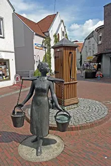 Midtown Prints: sculpture The Water Bearer in the old town, Germany, Lower Saxony, Frisia, Jever