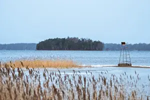 Faded Prints: Sea landscape with mood cloudy day and life saving chair at winter afternoon in Finland