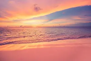 Sea ocean beach sunset sunrise landscape outdoor. Water wave with white foam. Beautiful sunset colorful sky with clouds. Natural island, sun rays