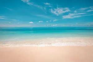 Sea sand sky concept. Tropical island paradise, beach view with endless sea horizon. Tranquil relaxing peaceful nature landscape, waves splashing surf