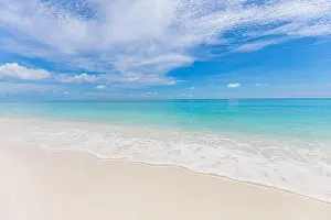 Sea sand sky concept. Tropical island paradise, beach view with endless sea horizon. Tranquil relaxing peaceful nature landscape, waves splashing surf