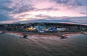 The seafront and Ferris wheel at dusk in Felixstowe, Suffolk, UK