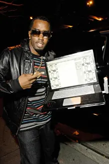 2009 Prints: Sean Combs aka Diddy showing his Twitter page with a labtop in 2009