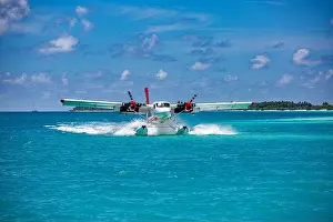 Seaplane at tropical beach resort. Luxury summer travel destination with seaplane in Maldives islands. Exotic vacation holiday transportation Maldives