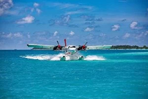 Images Dated 7th May 2018: Seaplane at tropical beach resort. Luxury summer travel destination with seaplane in Maldives