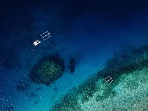 Lagoons Prints: Seascape aerial view over blue ocean with coral reef and boats in Bali