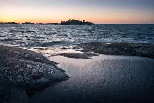 Seascape with windy weather and sunset at evening light in coastline, Finland