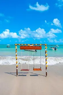 Eco Tourism Prints: Two seat swing decorated with sunflower flowers on a beautiful beach of fine sand