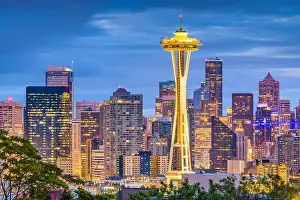 SEATTLE, WASHINGTON - JUNE 26, 2018: The Space Needle towers in front of the downtown Seattle skyline at dusk