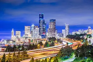 Seattle, Washington, USA downtown city skyline over highways at dusk