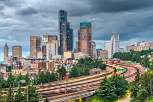 Seattle, Washington, USA downtown city skyline over highways at dusk