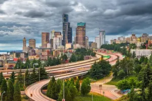 Seattle, Washington, USA downtown city skyline over highways at dusk