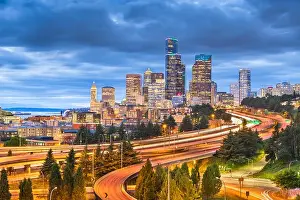Seattle, Washington, USA downtown skyline and highways at dusk