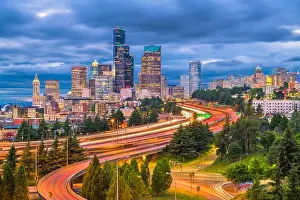 Seattle, Washington, USA downtown skyline and highways at dusk