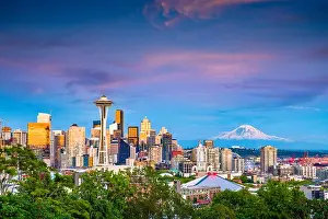 Seattle, Washington, USA downtown skyline at night with Mt. Rainier