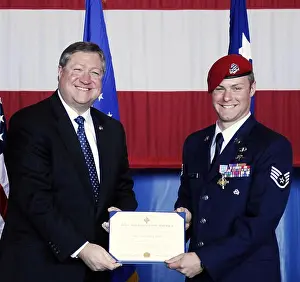 Secretary of the Air Force Michael B. Donley presents Staff Sgt. Zachary Rhyner the Air Force Cross March 10 at Pope Air Force Base, N.C