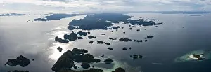 Misool Prints: Seen from above, remote islands are surrounded by coral reefs in Raja Ampat