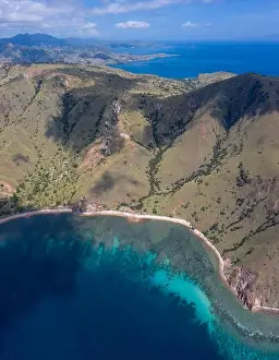 Rinca Prints: Seen from an aerial view, afternoon light shines on rugged islands in Komodo National Park