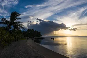 Seen from an aerial view, the tropical island of Flores is illuminated at sunset. Flores is part of the Lesser Sunda Islands of Indonesia