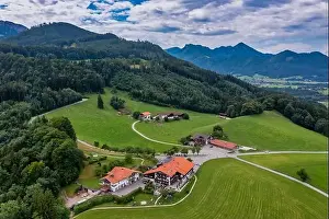 Feel Prints: The Seiser Alm at the lake Chiemsee shot by a drone from above - the beautiful restaurant at the bavarian alps