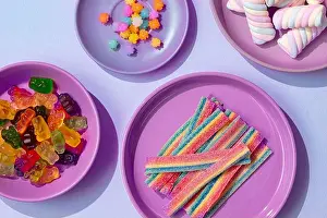 Tableware Prints: A selection of colorful sweets and treats are arranged on a pastel-colored table