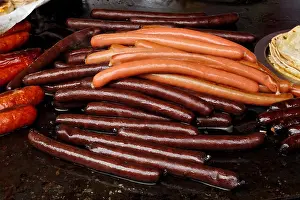 Wiener Prints: Selection of wiener sausages on cast iron griddle
