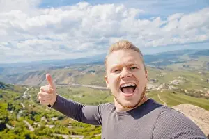 Calascibetta Prints: Selfie photo traveler man smiling Castello di lombardia in Enna Sicily, Italy