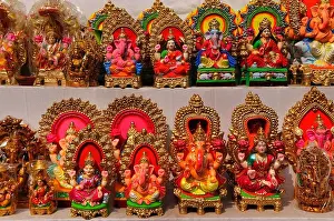 Selling Hindu Gods statues at the market a day before Diwali festival in Old Delhi