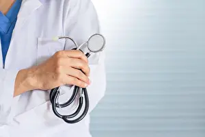 White Coat Prints: senior asian woman doctor wearing glasses and uniform with stethoscope in hand Healthcare and medical concept