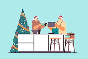 Claus Prints: senior couple in santa hats cooking together in kitchen christmas dinner preparation new year holidays celebration