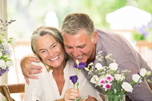 Smelling Prints: Senior couple smelling flowers