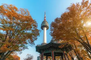 Seoul Tower with yellow and red autumn maple leaves at Namsan mountain in South Korea