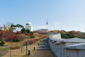 Seoul Tower with yellow and red autumn maple leaves at Namsan mountain in South Korea