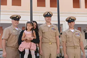 6th Fleet Prints: On September 16, 2014, Chief Electronics Technician Jonathan Beard poses with family