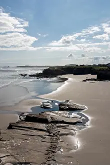 Asturias Prints: A serene beach with rocky outcrops